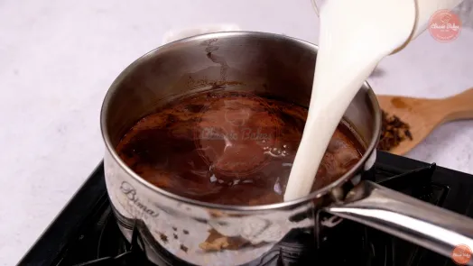 Milk being poured into the mixture