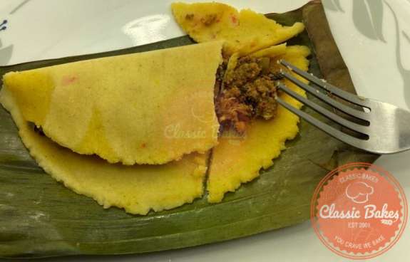Trinidad Pastelle on top of banana leaf