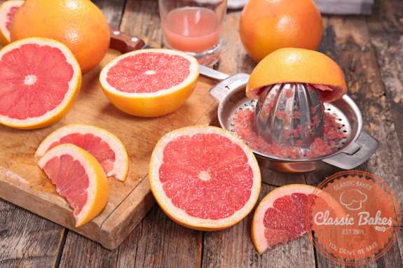 Sliced Grapefruits with squeezer