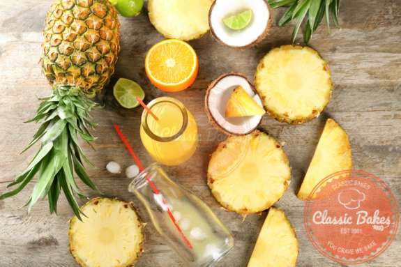 Sliced Pineapples in wooden background