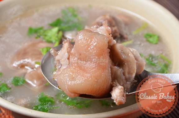Close up shot of Pig Foot Souse with a spoon