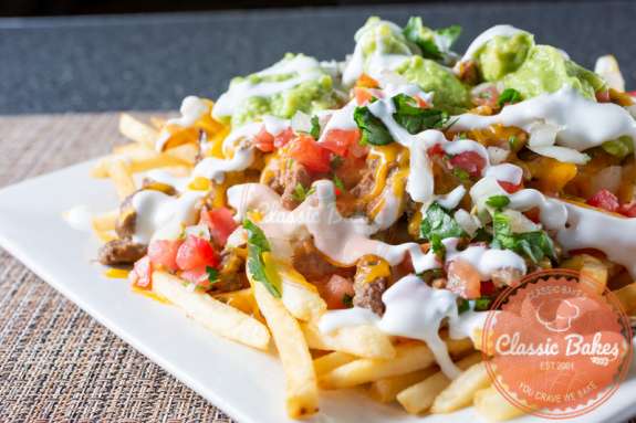 Carne Asada Fries in plate in wooden background