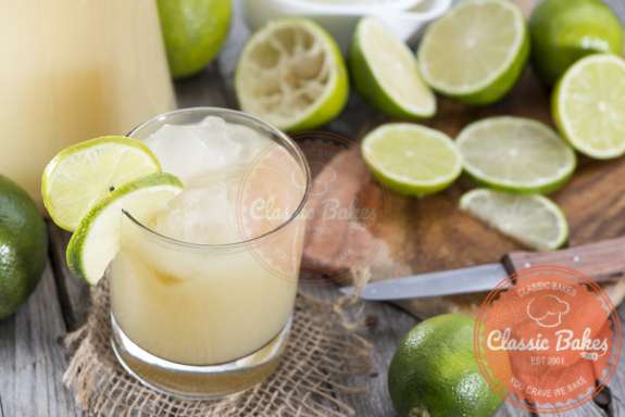 Fresh Lime Juice with knife and cutting board on side