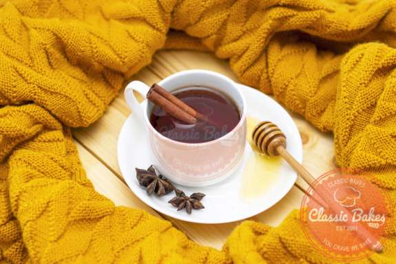 Cinnamon Tea surrounded by yellow cloth