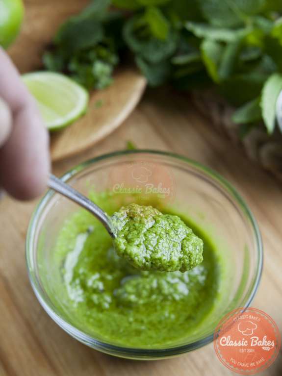 Close up shot of a spoon of Cilantro Chutney 