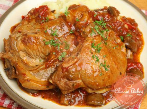 Front shot of Fall Apart Slow Cooker Pork Chops in a serving plate