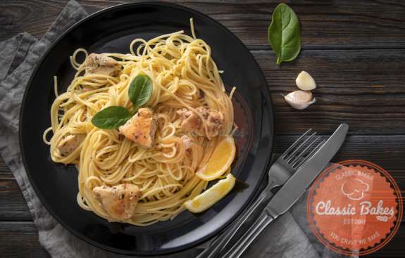 Aerial view of Lemon Chicken Pasta with knife on the side