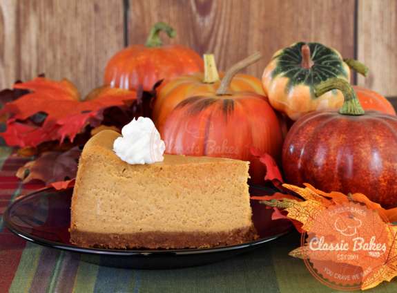Front shot of Pumpkin Cheesecake in a plate with autumn theme at the background