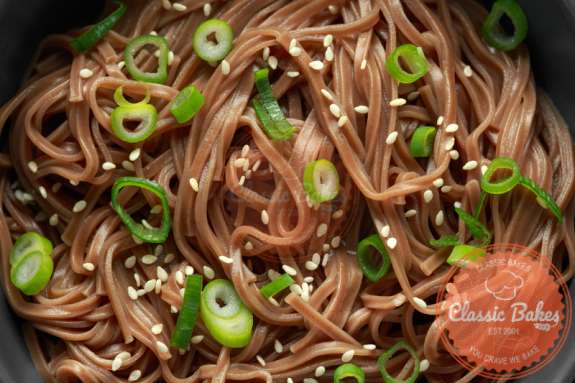 Close up shot of Sesame Soba Noodles with green onions