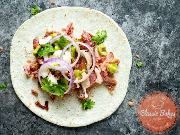 Aerial shot of Instant Pot Pulled Pork Tacos in marble background