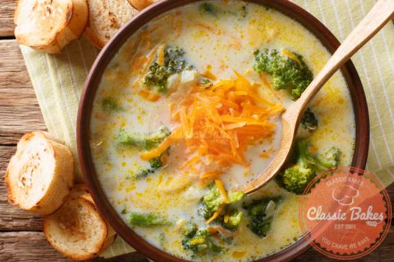 Aerial shot of Keto Broccoli Cheese Soup in a bowl with a spoon