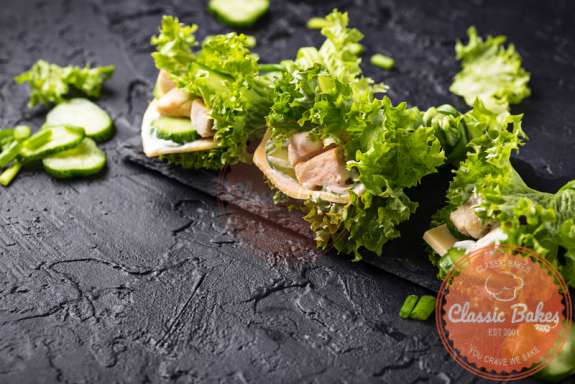 Lettuce Wrap Sandwich on top of wooden board