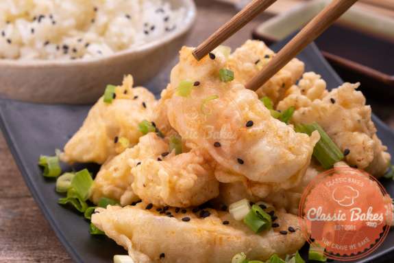Chicken Tempura being picked up with a chopstick