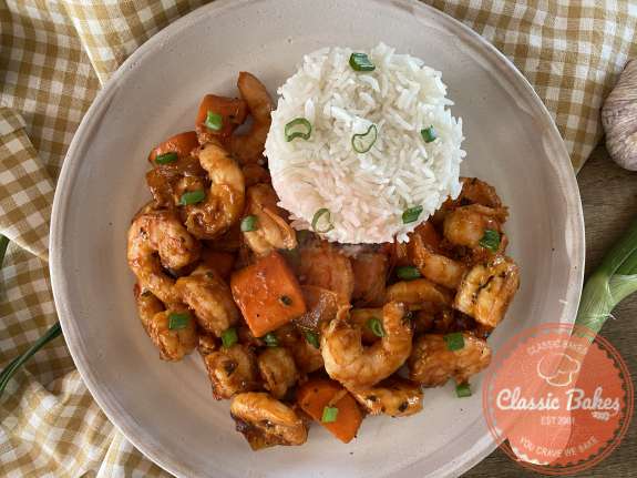 Aerial shot of Trinidadian Pepper Shrimp with rice on the side