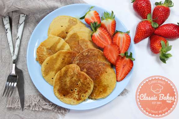 Vegan Mini Pancakes on a plate with strawberries