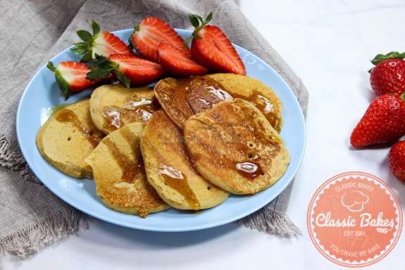 Close up of Vegan Mini Pancakes on a plate with strawberries