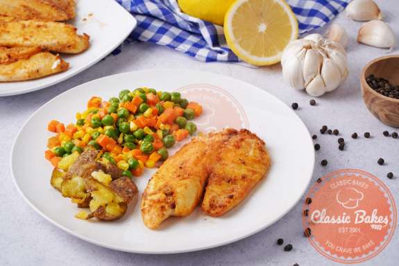 Air Fryer Tilapia on a plate with peas
