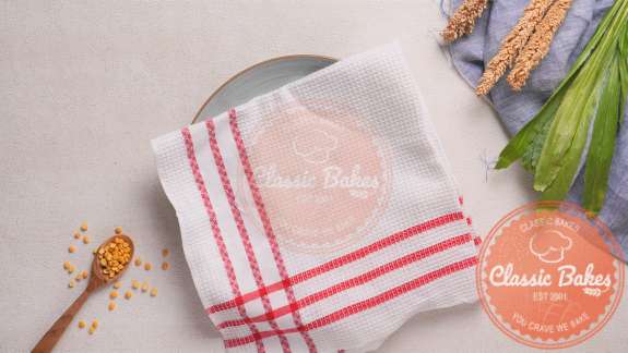 Arial of a plate covered with a kitchen towel 