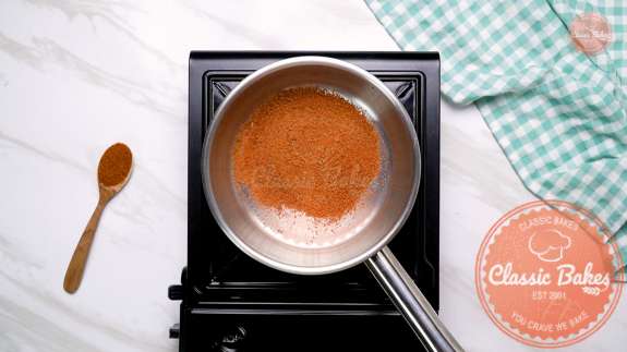 Arial of sugar in a pot on a stovetop 