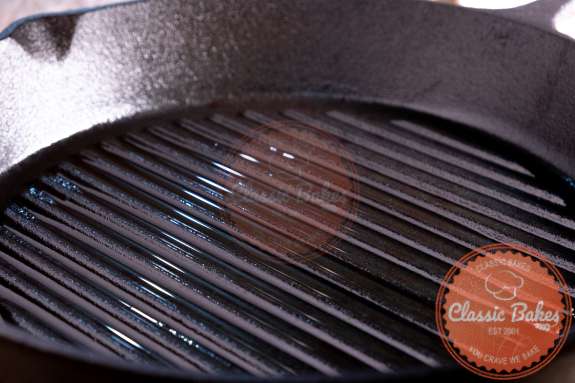 Cast iron grill pan being heated up 