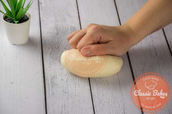 Dough being kneaded on a countertop 