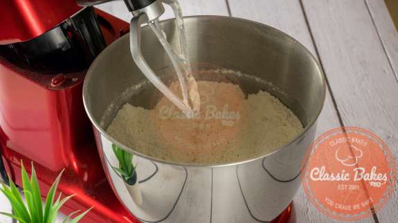 Dry ingredients in the bowl of a stand up mixer