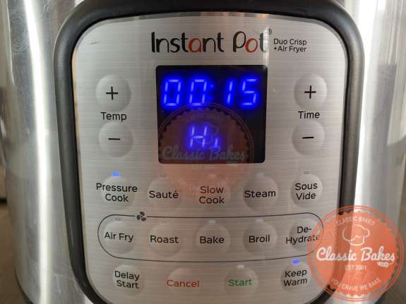 Front view of an instant pot being set 