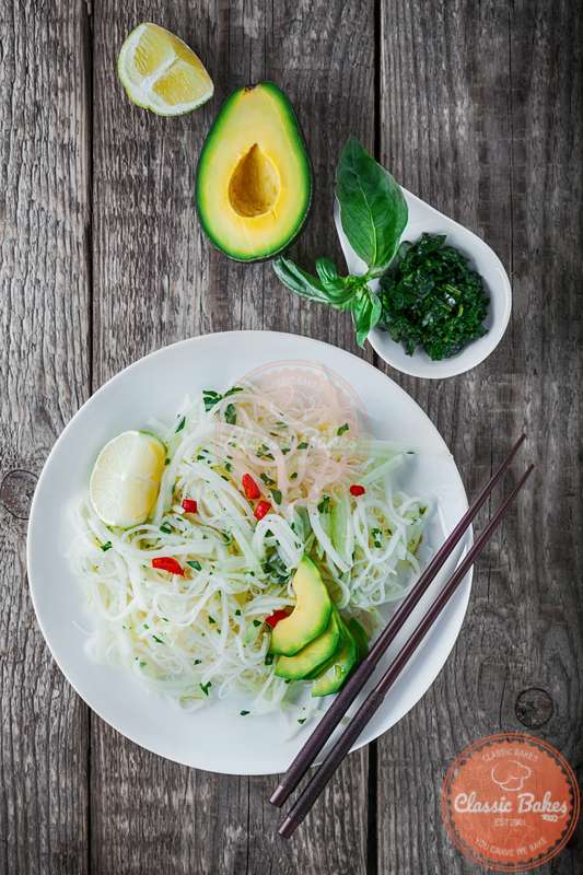 Overview of Kohlrabi Noodle Salad with Avocado on the side 