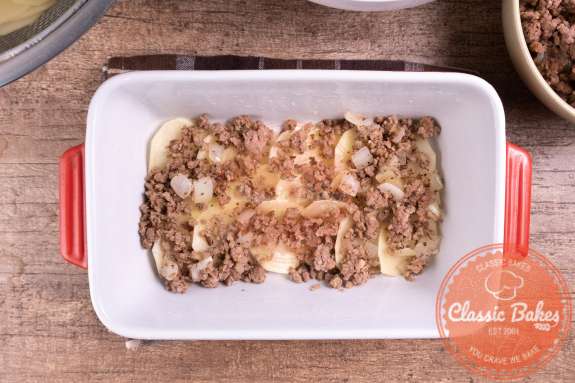 Layer of ground beef in a casserole dish 