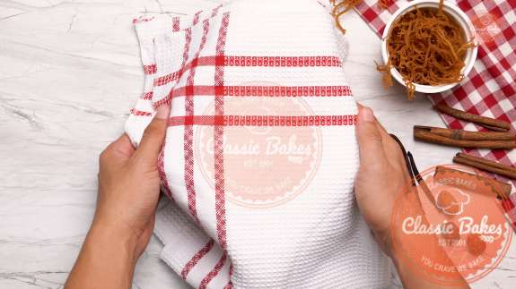 Overview of a kitchen towel covering a bowl 