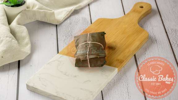 Paime in banana leaf tied into a package with a string 