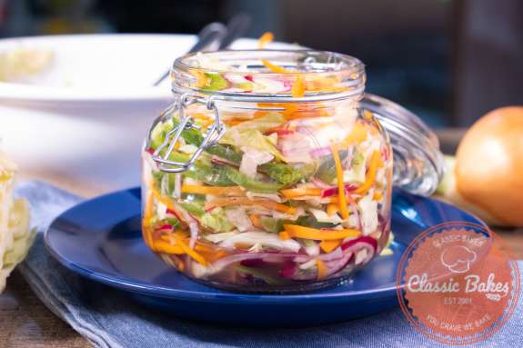 Shredded vegetables in a glass container 