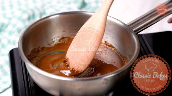 Sugar being stirred in a pot 