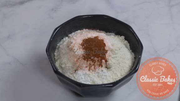 Bowl containing dry and wet ingredients for cake batter 