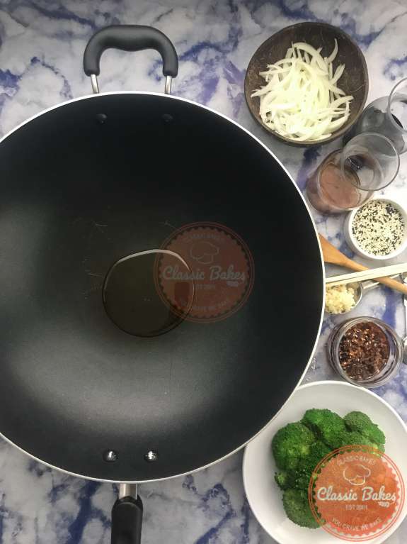 Arial view of a wok with sesame oil inside 