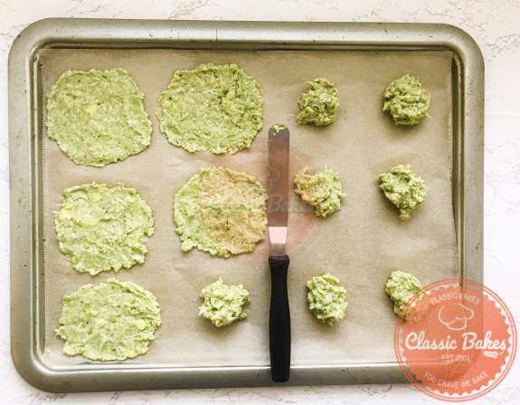 Avocado mixture being spread out on a tray using an off set spatula. 