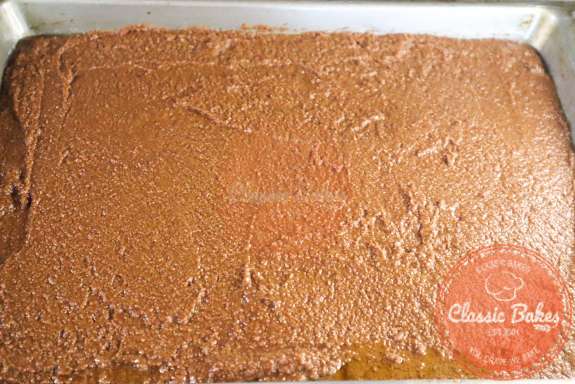 Choclate cake batter in a baking pan. 