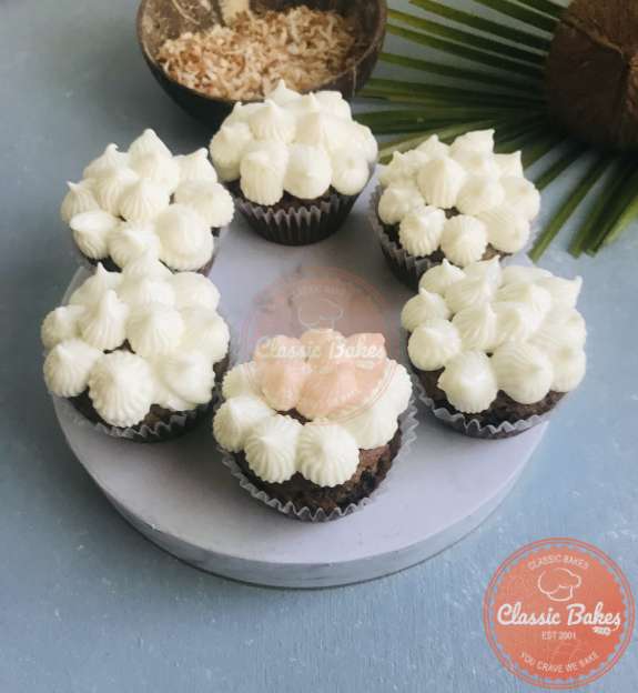 Coconut cupcake topped with icing 