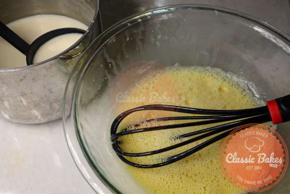 Eggs being whisked into the peach ice cream.