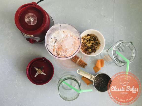 Overview of carrot cake smoothie ingredients in a blender 