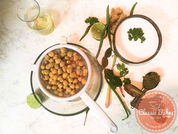 Overview of chickpeas straining in a colander 