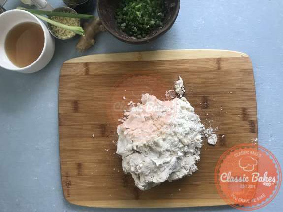 Overview of dumpling dough on a cutting board 