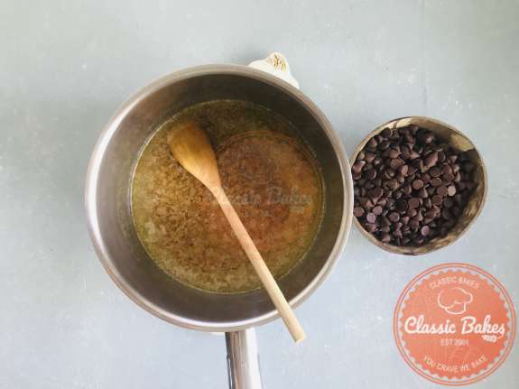 Overview of a pot of brown sugar and butter cooking 