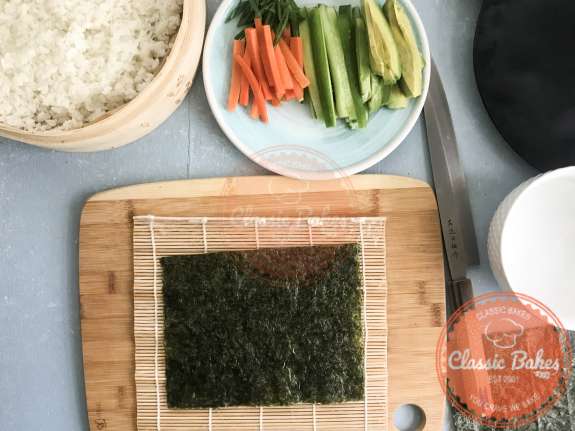 Overview of a sheet of nori on a cutting board 