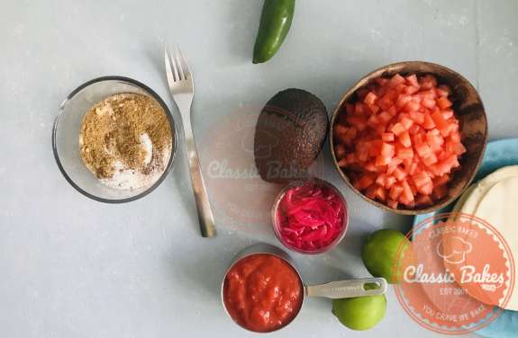 Overview of taco seasoning being mixed in a small bowl using a fork 