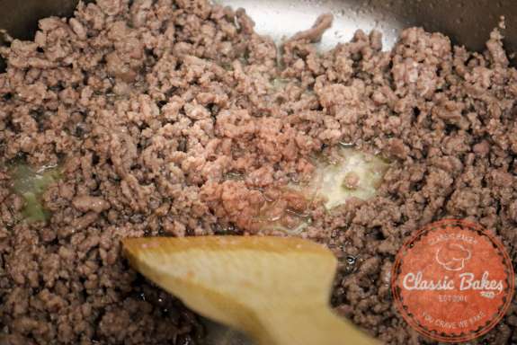 Sauteing ground beef in a soup pot. 