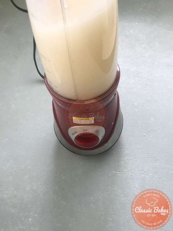 Side View of sea moss being blended in a blender 