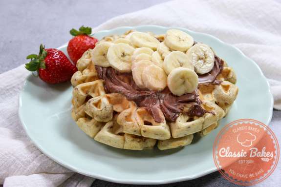 Sideview of a completed plate of banana bread waffles 
