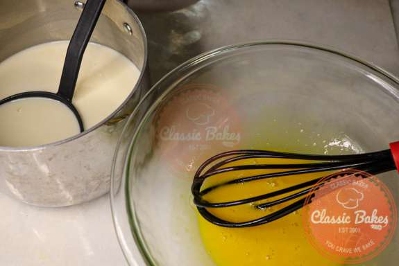 Whisking the peach ice cream base into the eggs. 