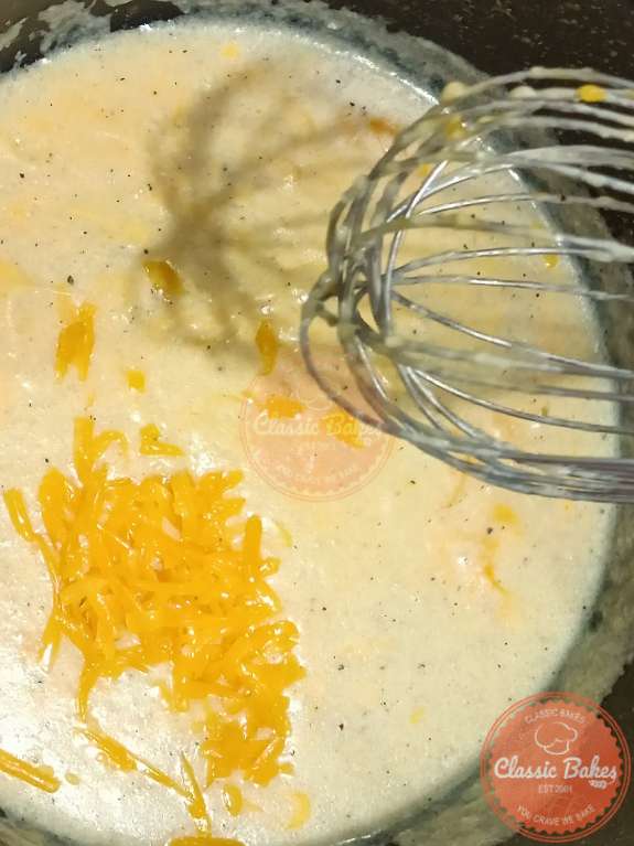 adding the cheddar cheese and mustard powder